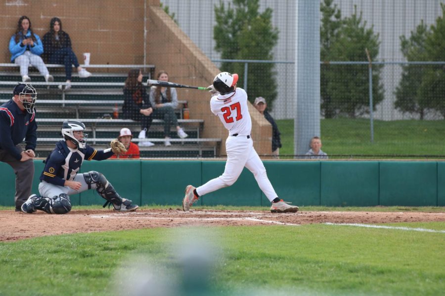 Sophomore Joseph Chiarodo hits the ball during a April 6 game against OFallon at the District 7 Sports Complex.