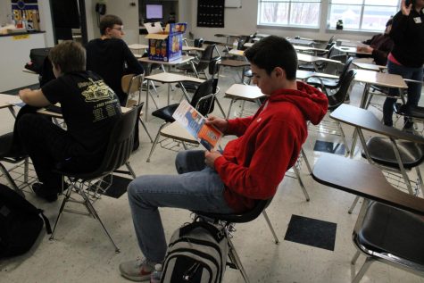 EHS student reads a magazine in class on March 2. 