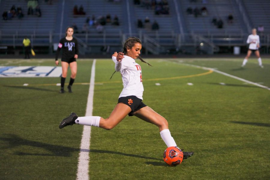 Senior defender Mariah Jackson lunges towards the ball at a March 28 game against Belleville East.