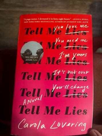 A copy of the book Tell me Lies sits on a readers desk.