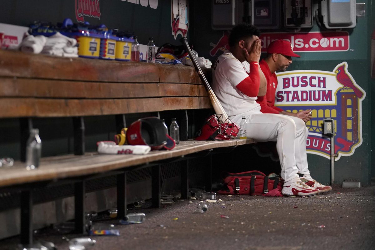 Wilson Contreras sits in the dugout after an 11-3 loss on June 13, 2023.