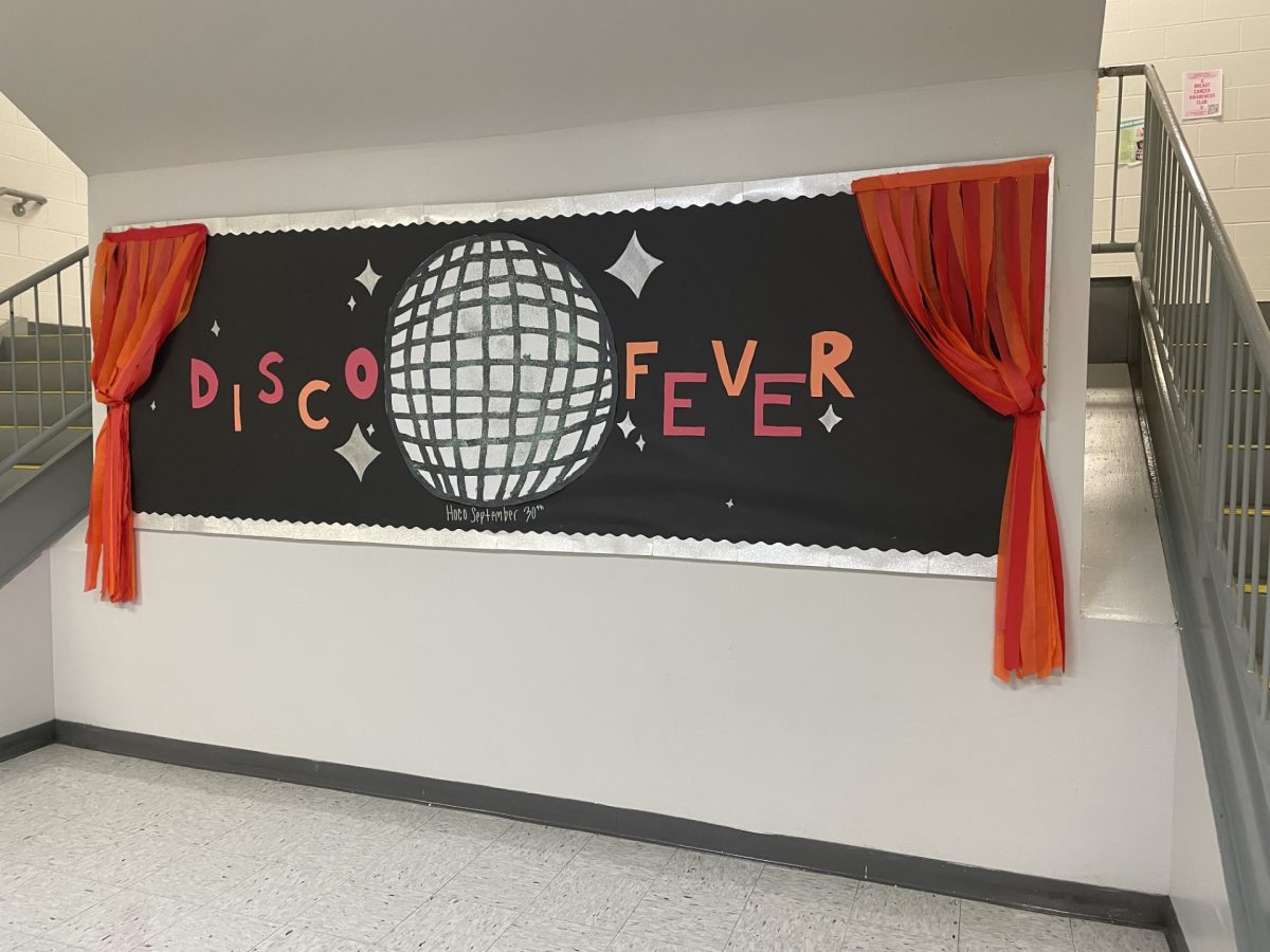 The bulletin board in the main staircase is decorated to match the Lets Groove Tonight theme. 