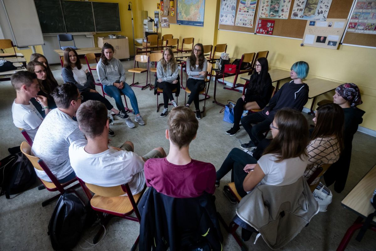 Students meet to discuss solutions to school-wide issues.