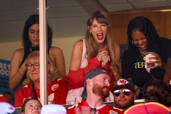 Taylor Swift interacts with Donna Kelce at a Kansas City Chiefs game.