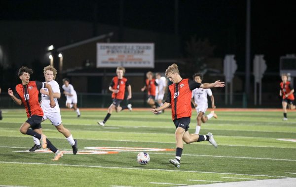 Senior Evan Moore prepares to send the ball at the Sept. 7 game against Gibault Catholic.