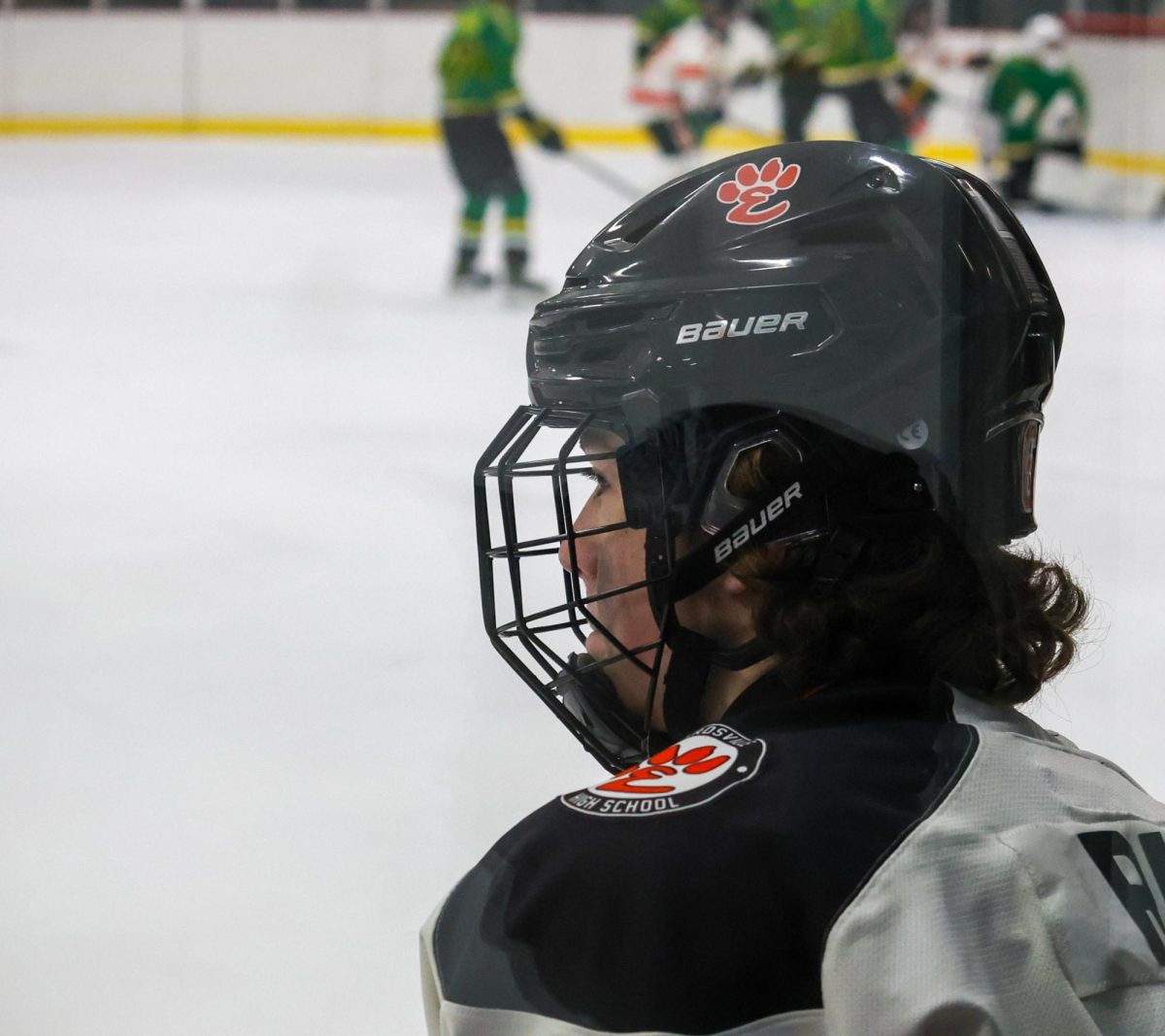 Jackson Ruf on sidelines wearing a neck guard during the Jan. 5 game.