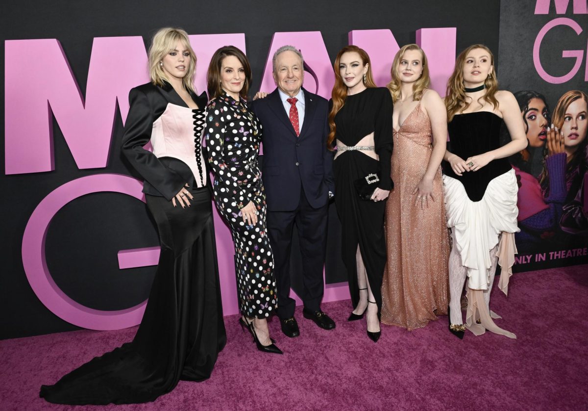 From left to right, Reneé Rapp, Tina Fey, Lorne Michaels, Lindsay Lohan, Angourie Rice and Bebe Wood pose at the "Mean Girls" premiere on Jan. 8 in New York City, New York. 