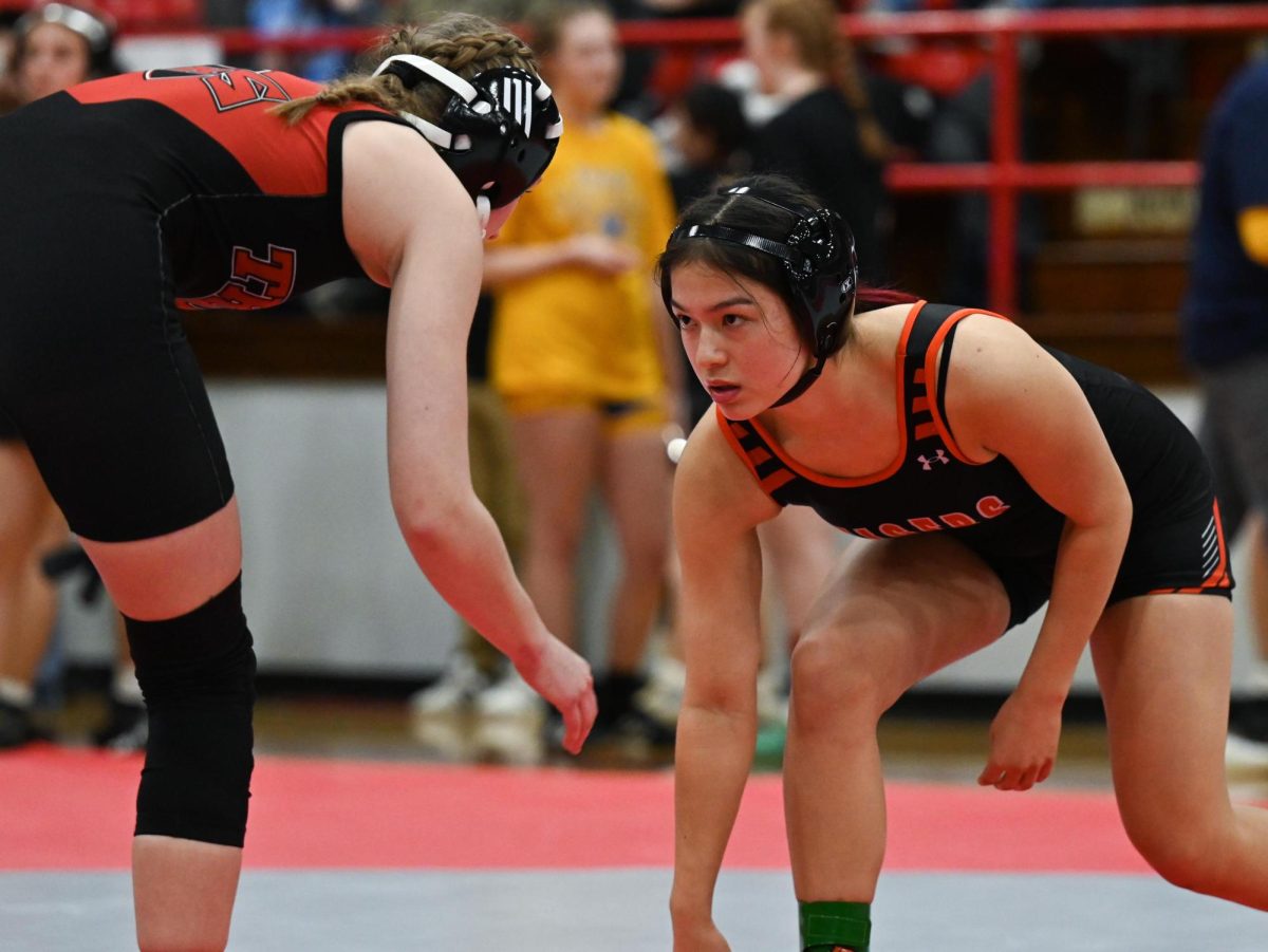 The girls wrestling team goes against West Frankfurt on Jan. 26.