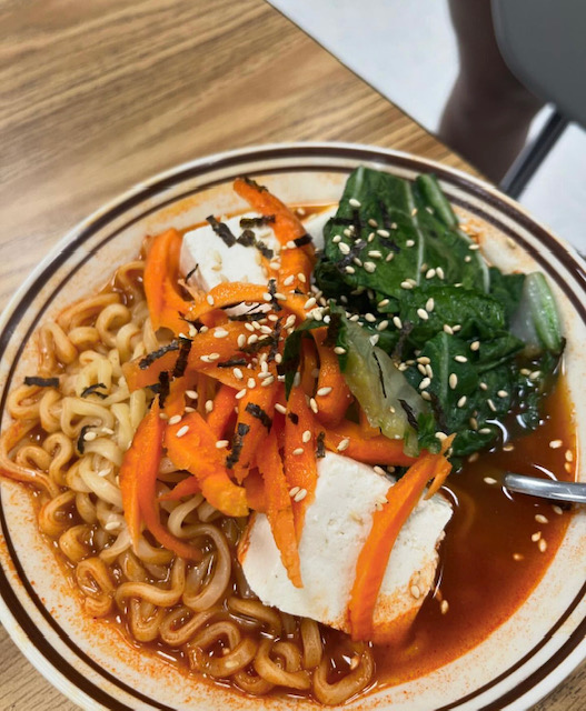 A bowl of packet ramen with traditional add-ons, made by attendees at Asian Cultural Club's "All You Can Eat Ramen" event.