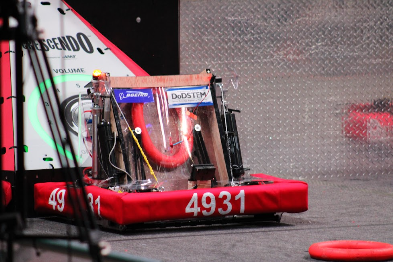 Edwardsville Techonologies' bot, 4921, is placed on the course. 