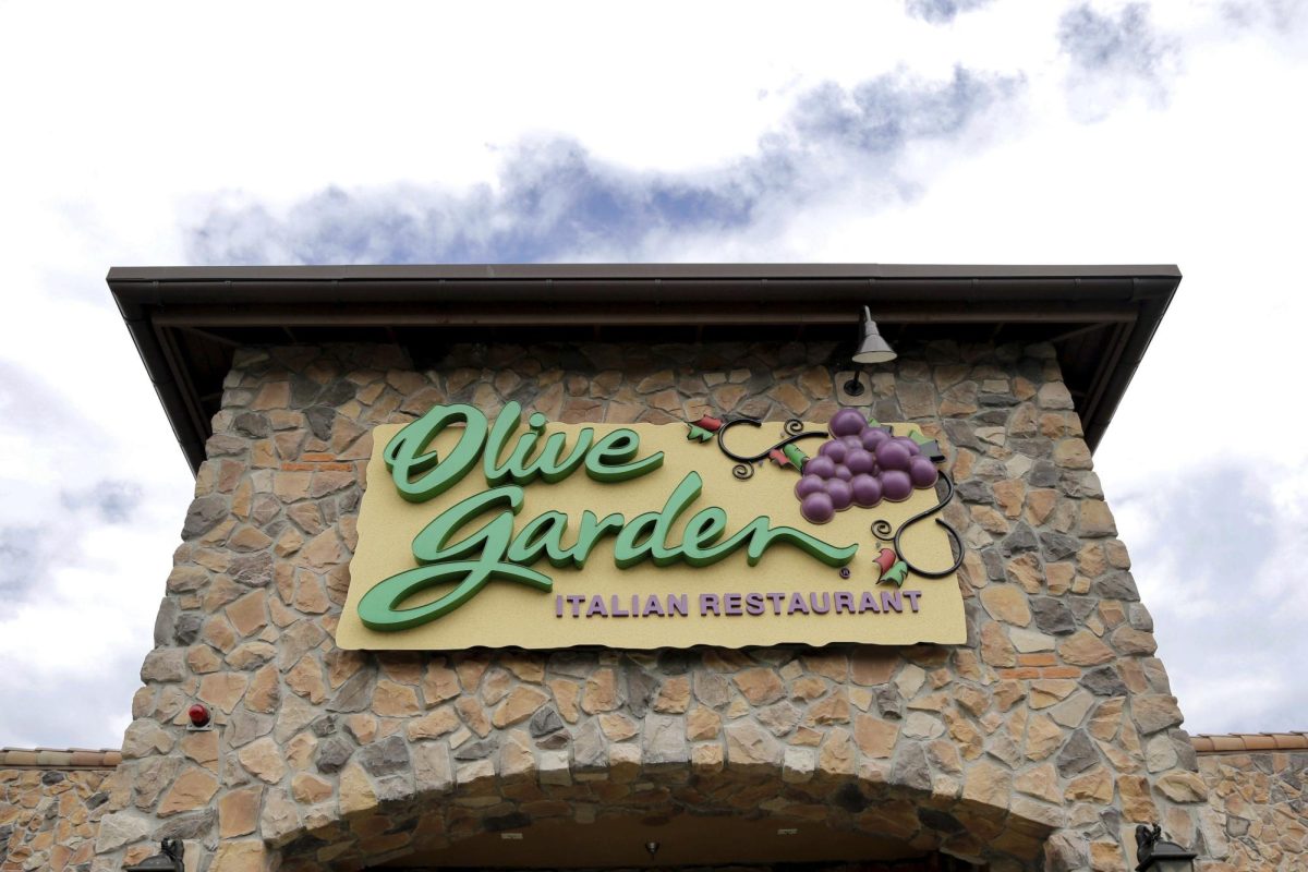 This Monday, June 27, 2016 file photo shows an Olive Garden restaurant in Methuen, Mass. On Friday, Aug. 30, 2019, The Associated Press reported on stories circulating online incorrectly asserting that Olive Garden is "funding" President Donald Trump's 2020 re-election campaign. The company says that neither the Olive Garden nor its owner, Darden Restaurants, contributes to presidential candidates.