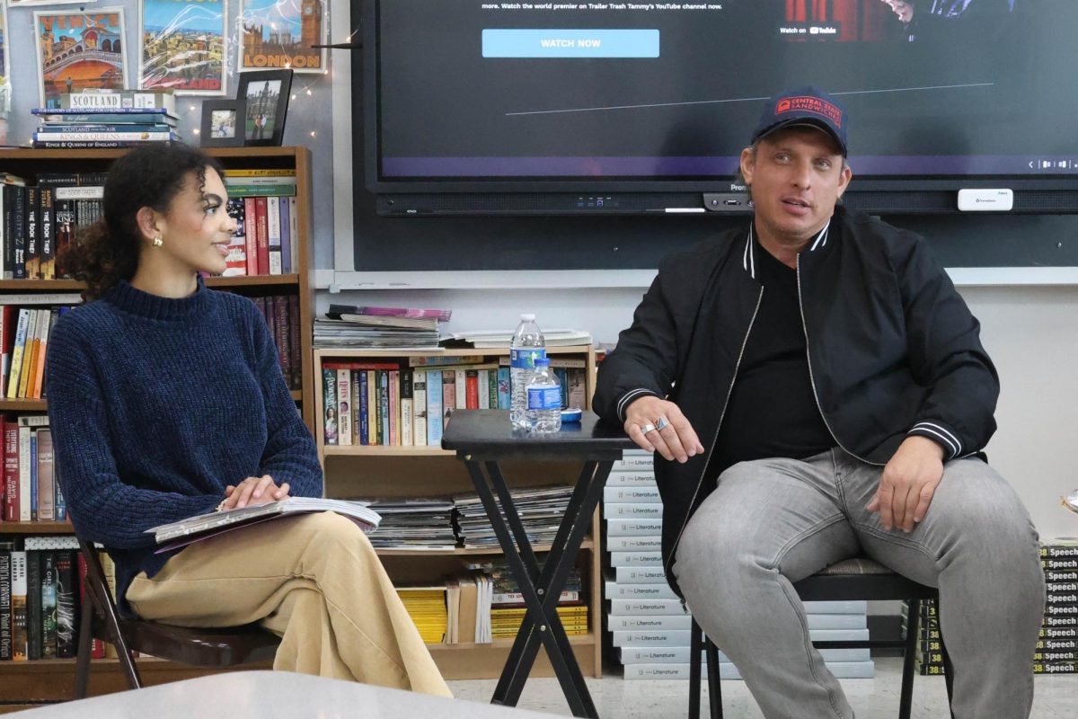 Senior Jozie Beedie interviews local actor and comedian Rafe Williams. Williams visited English teacher Cara Lanes classroom after school April 22.