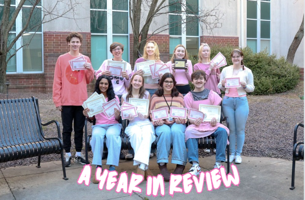 The publications staff poses with their Southern Illinois School Press Association conference awards for the March edition of The Claw.