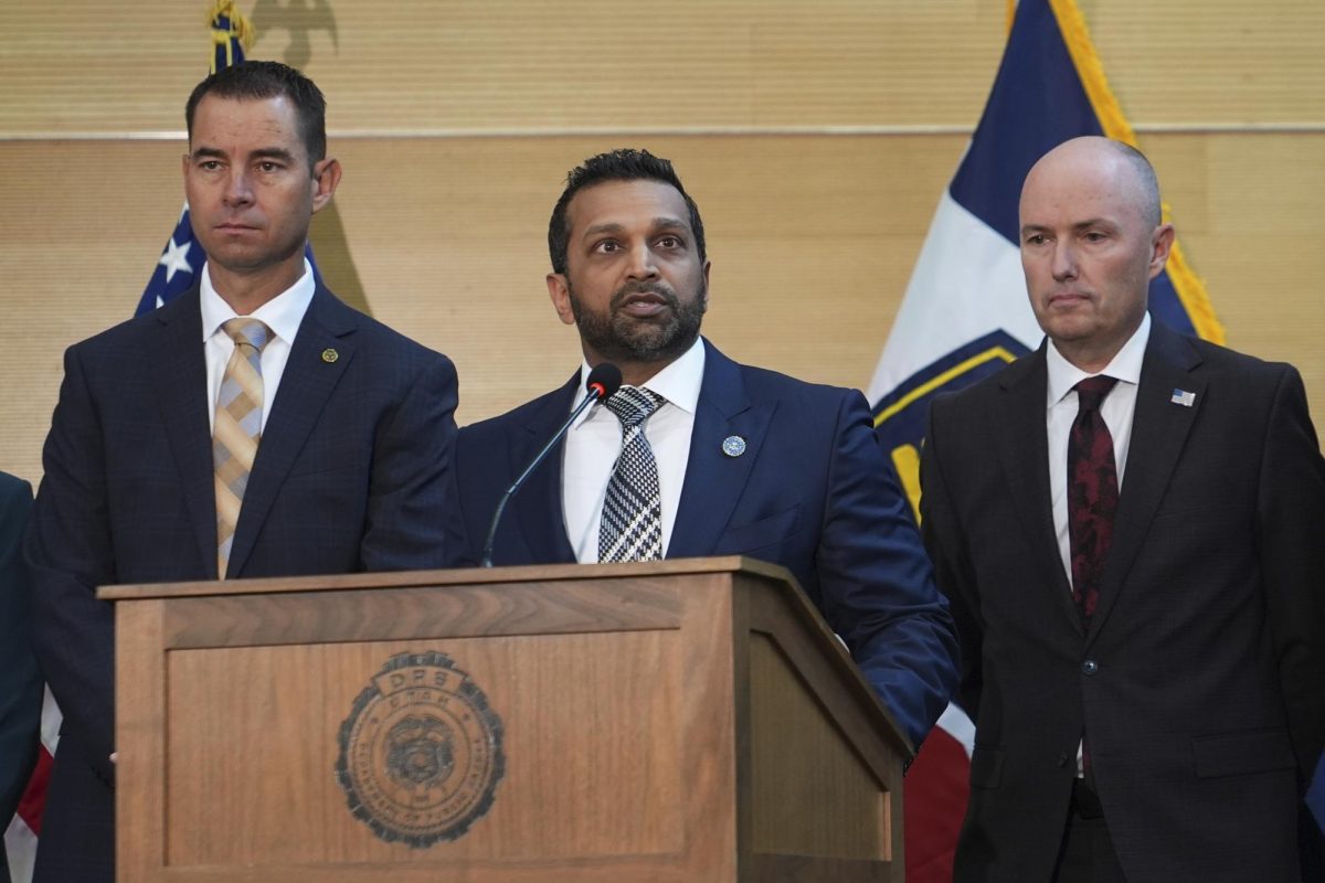 FBI Director Kash Patel speaks at a news conference Friday Morning as Utah Department of Public Safety Director Beau Mason (left) and Utah Gov. Spencer Cox (right) listen. 