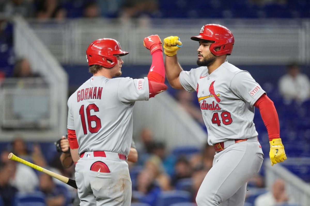 St. Louis Cardinals designated hitter Ivan Herrera (48) celebrates with on-deck batter Nolan Gorman (16) after hitting a home run during the ninth inning of a baseball game against the Miami Marlins.